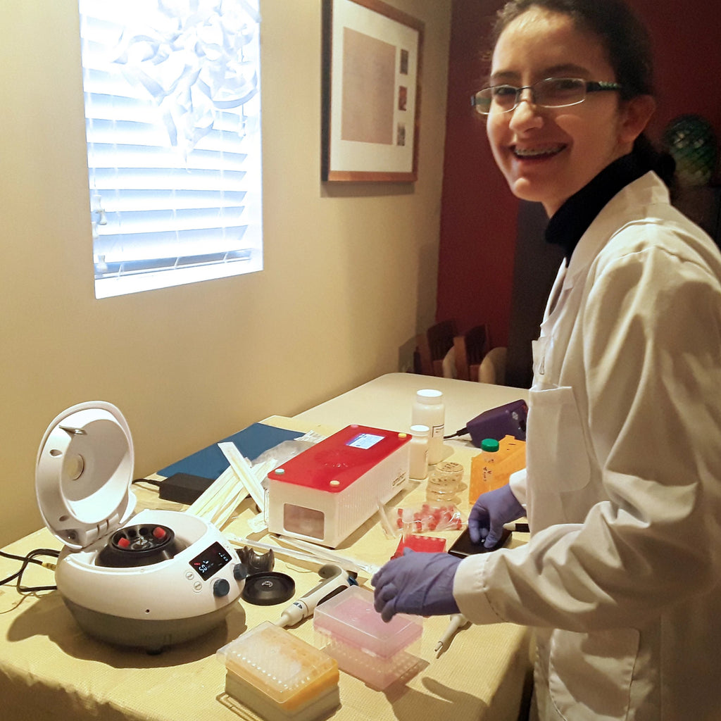young science fair winner using a Microcentrifuge for biohacking beginners, genetic engineering beginners, DIYbio, life science class, AP biology class laboratory equipment.