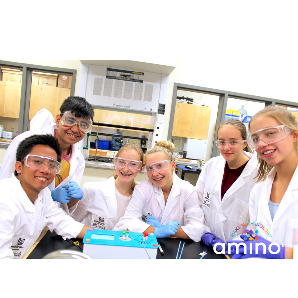 students with mino Labs’ Zero to Genetic Engineering hero starter pack for  middle school science, biology, genetics, high school science, biology, genetics, NGSS.  Learn what is DNA, what is a gene, cell theory, genetic engineering, bioart, biotechnology, biohacking and genetic engineering with the world's first biohacking and biotechnology STEM beginner's book and starter pack of science project kits, biotechnology project kits